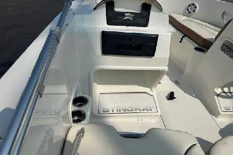 Slide: The Image of 2024 Stingray 172SC boat interior with seating and storage compartments. - 3