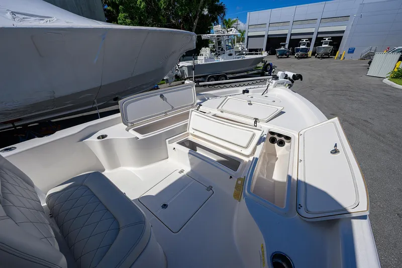 Slide: The Image of 2021 Blue Wave 2600 PureBay boat interior with open storage compartments. - 18