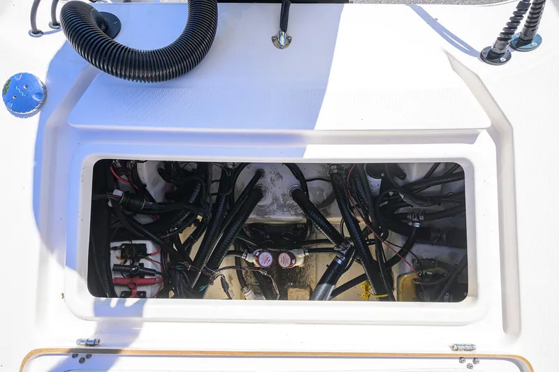Slide: The Image of 2021 Blue Wave 2600 PureBay boat wiring compartment with hoses and cables. - 28