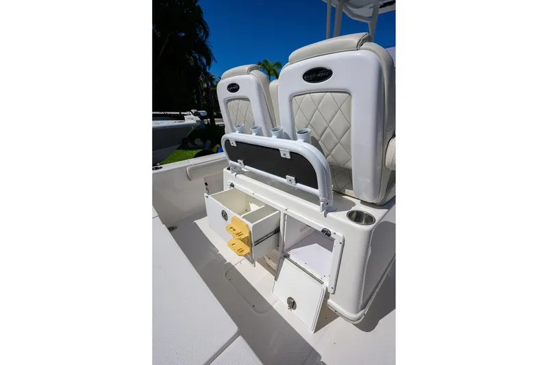 Slide: The Image of 2021 Blue Wave 2600 PureBay boat interior with storage compartments and seating. - 34
