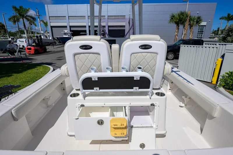 Slide: The Image of 2021 Blue Wave 2600 PureBay boat interior with seating and storage compartments. - 35