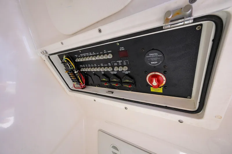 Slide: The Image of Electrical panel of 2021 Blue Wave 2600 PureBay boat, featuring switches and wiring. - 40