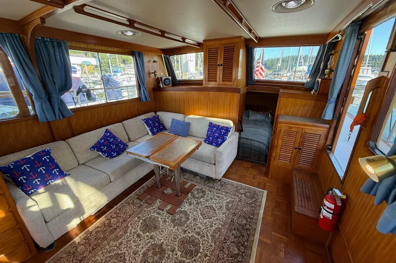 Slide: The Image of Interior of 1983 CHB 41 Classic Trawler with cozy seating and nautical decor. - 15