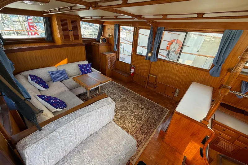 Slide: The Image of Interior of 1983 CHB 41 Classic Trawler with cozy seating and nautical decor. - 3