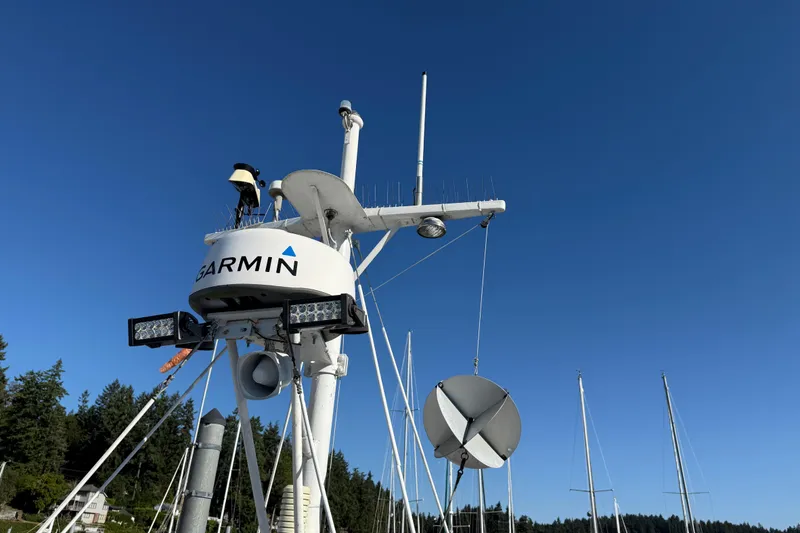 Slide: The Image of Radar and communication equipment on a 1983 CHB 41 Classic Trawler against a clear blue sky. - 34