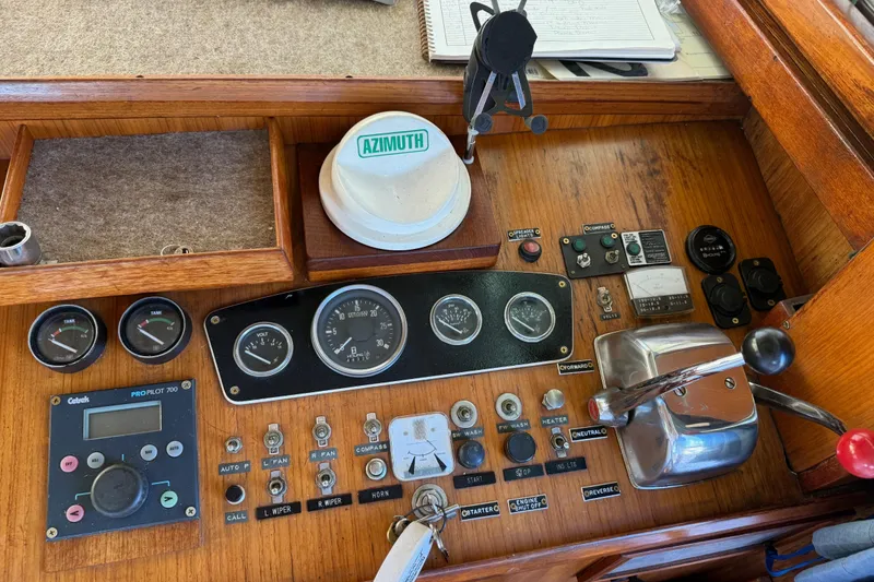 Slide: The Image of 1983 CHB 41 Classic Trawler helm with gauges, controls, and navigation equipment. - 39