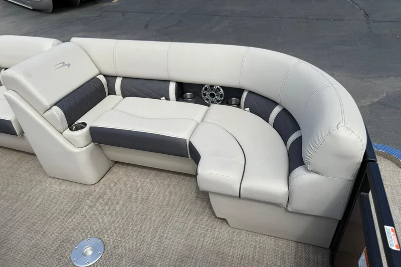 Slide: The Image of Luxurious seating on 2019 Bennington 22SX Premier pontoon boat, featuring plush upholstery and cup holders. - 10
