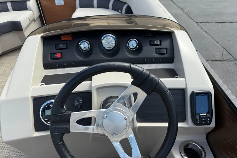 Slide: The Image of 2019 Bennington 22SX Premier boat dashboard with steering wheel and gauges. - 16