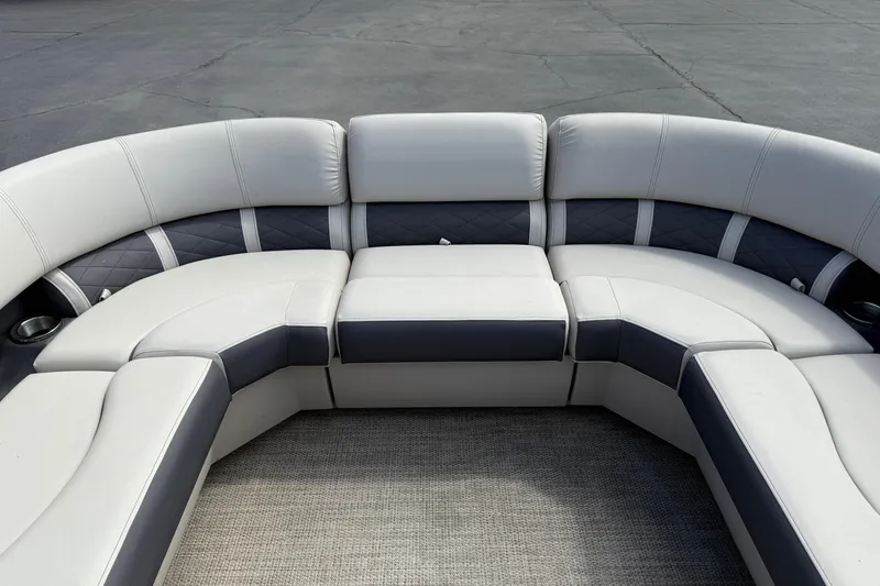 Slide: The Image of 2019 Bennington 22SX Premier boat seating, featuring luxurious gray and white upholstery. - 20