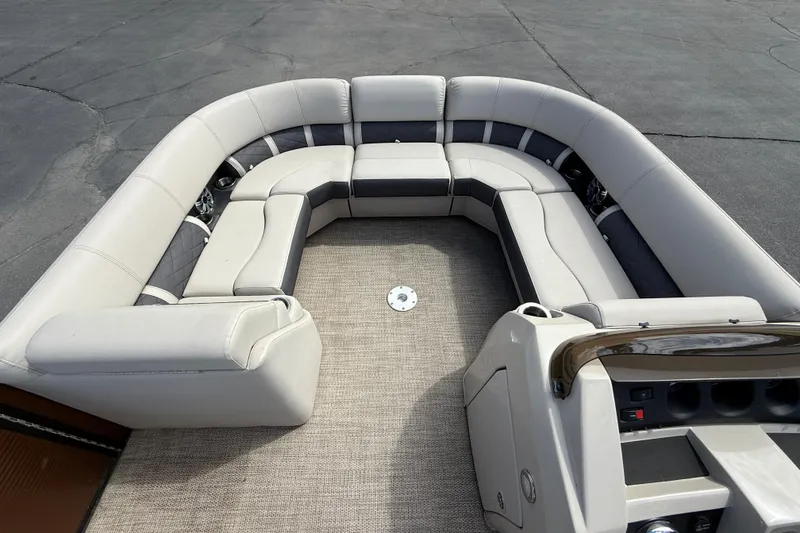 Slide: The Image of 2019 Bennington 22SX Premier pontoon boat with spacious seating and modern interior design. - 21