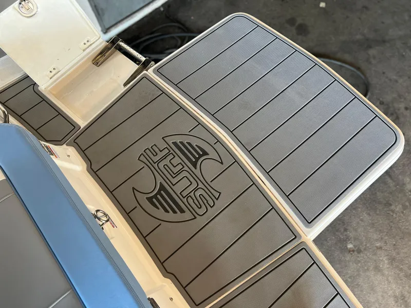 Slide: The Image of 2022 Chaparral 23 Surf boat deck with custom non-slip mat. - 21