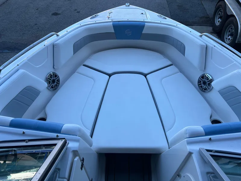 Slide: The Image of 2022 Chaparral 23 Surf boat with spacious bow seating and built-in speakers. - 5