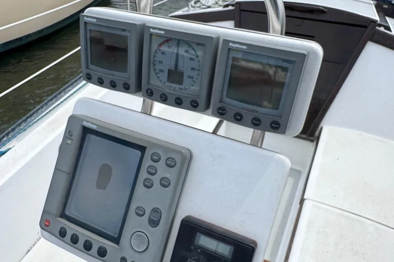 Slide: The Image of Cockpit instruments on a 1986 Catalina 38 sailboat, featuring navigation and speed displays. - 13