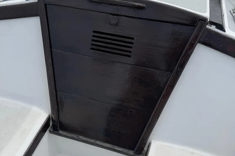 Slide: The Image of 1986 Catalina 38 sailboat hatch with dark wood finish. - 16