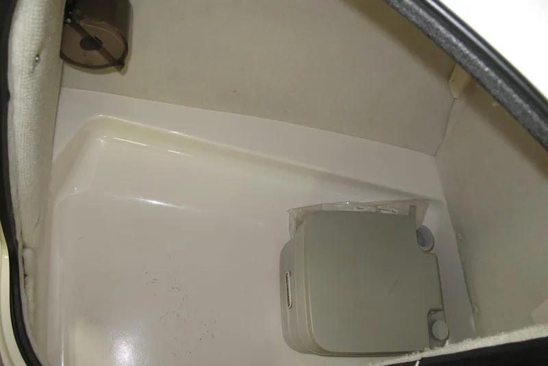 Slide: The Image of Interior of 2000 Chaparral 230 SSi boat showing compact toilet area. - 11
