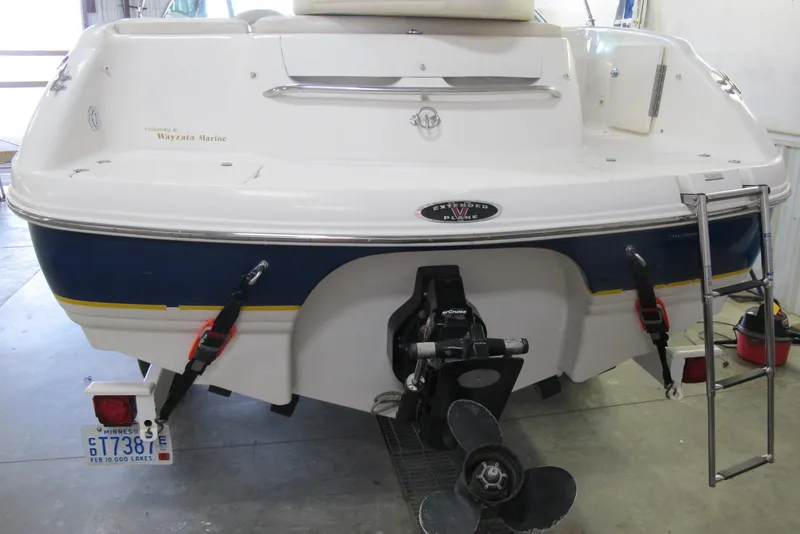Slide: The Image of Rear view of 2000 Chaparral 230 SSi boat with outboard motor and ladder. - 2