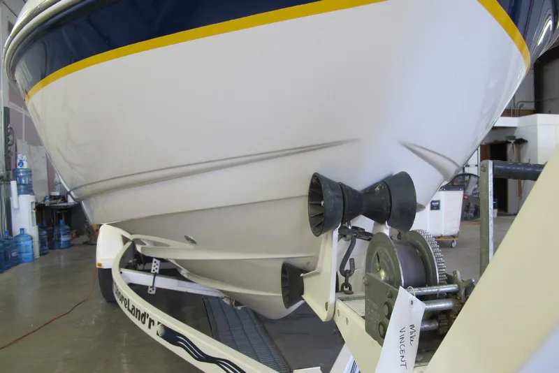 Slide: The Image of Chaparral 230 SSi 2000 boat on trailer in garage, close-up view. - 3