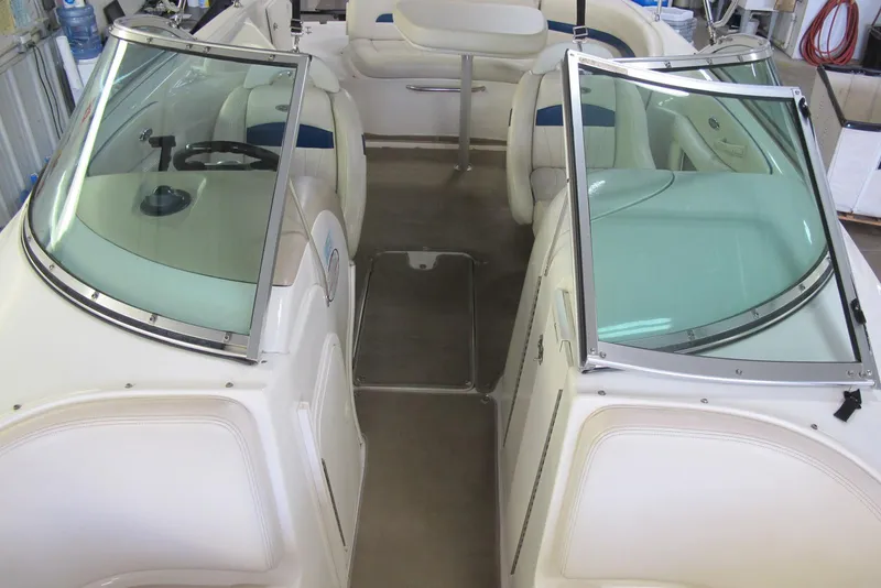Slide: The Image of Interior view of a 2000 Chaparral 230 SSi boat with seating and windshield. - 5