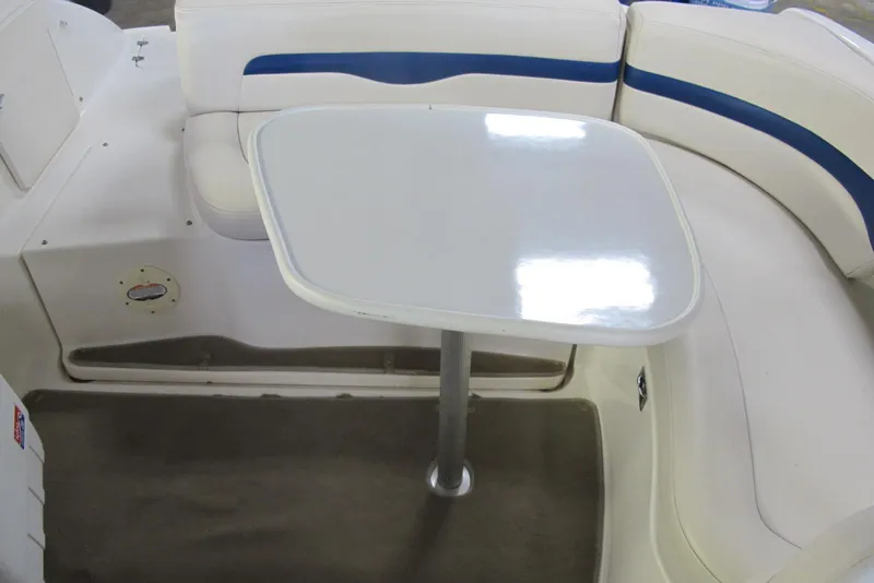 Slide: The Image of Interior of 2000 Chaparral 230 SSi boat with white seating and table. - 7