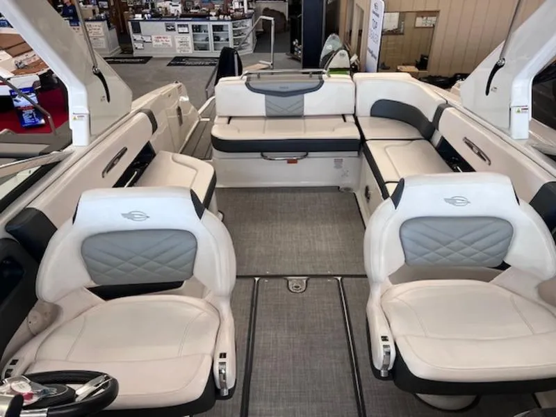 Slide: The Image of 2021 Chaparral 307 SSX boat interior with luxurious seating and modern design. - 11