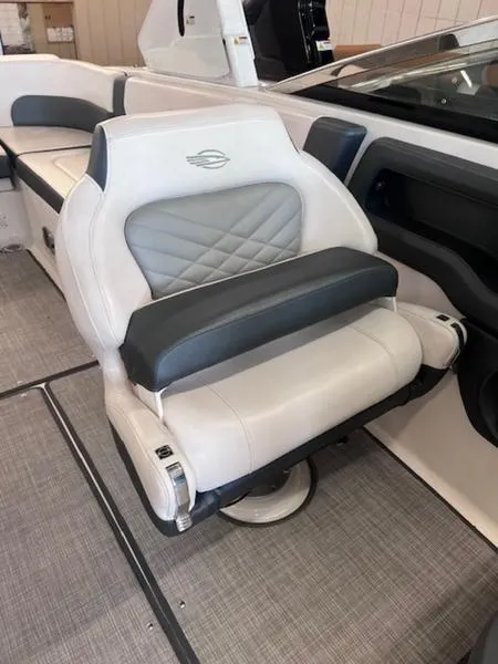 Slide: The Image of 2021 Chaparral 307 SSX boat interior with luxurious white and gray seating. - 14