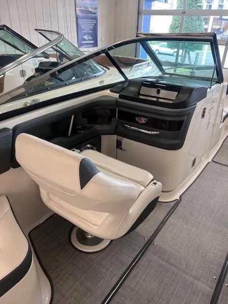Slide: The Image of 2021 Chaparral 307 SSX boat interior with sleek seating and modern dashboard design. - 16