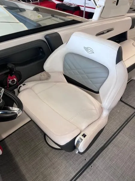 Slide: The Image of 2021 Chaparral 307 SSX boat interior with luxurious white seating. - 18