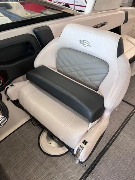 Slide: The Image of 2021 Chaparral 307 SSX boat seat with white and gray upholstery, featuring a quilted design. - 19
