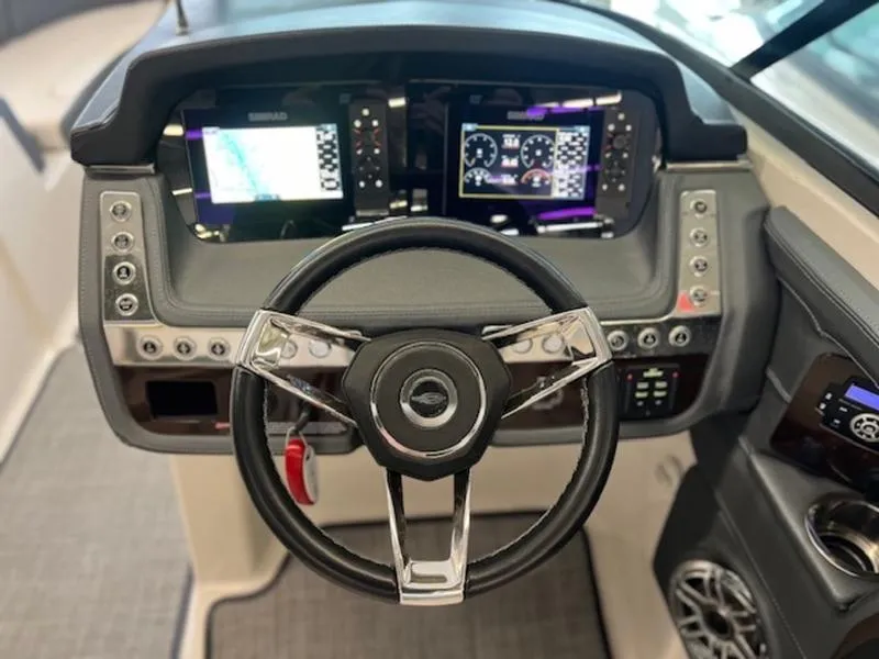 Slide: The Image of 2021 Chaparral 307 SSX dashboard with modern steering wheel and digital displays. - 23