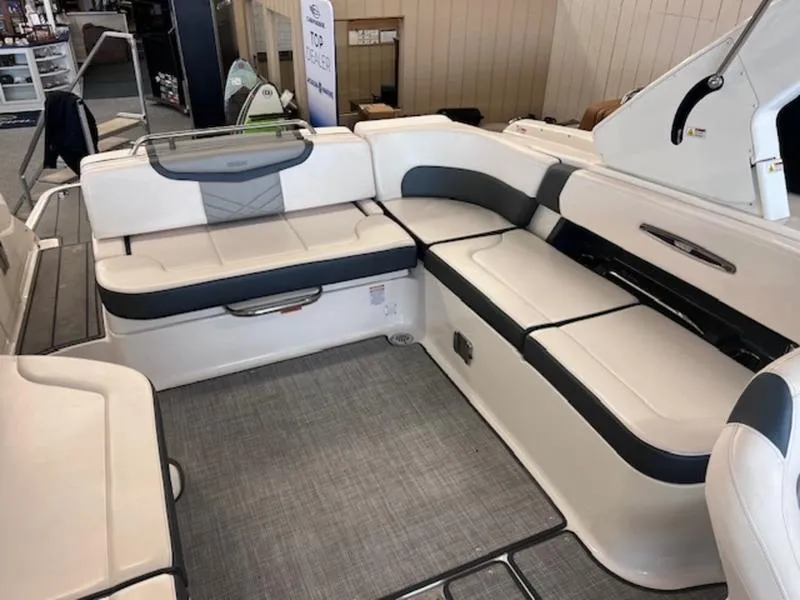 Slide: The Image of 2021 Chaparral 307 SSX boat interior with white and gray seating. - 27