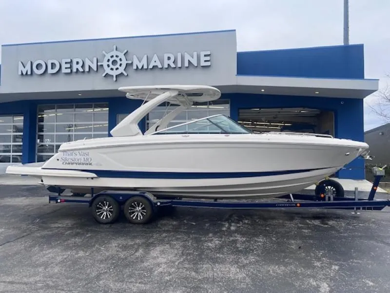 Slide: The Image of 2021 Chaparral 307 SSX boat on trailer outside Modern Marine dealership. - 4