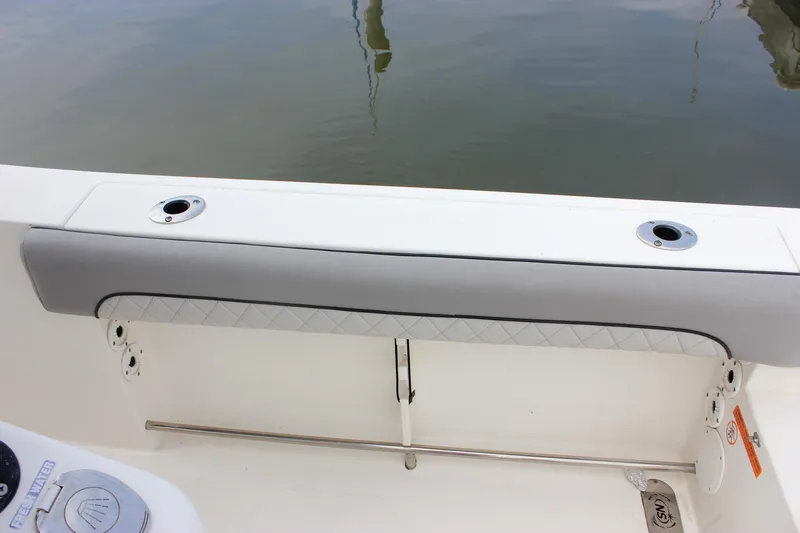 Slide: The Image of 2017 NauticStar 2602 Legacy boat interior with seating and control panel. - 14