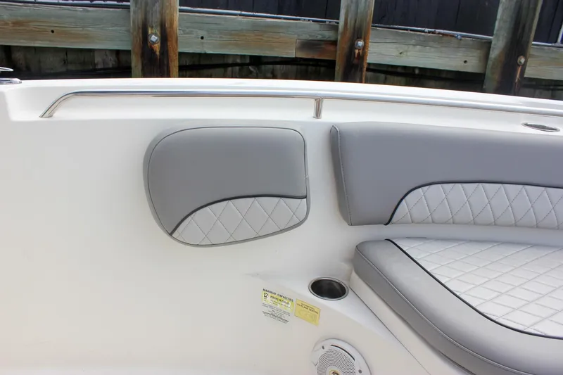 Slide: The Image of 2017 NauticStar 2602 Legacy boat with foldable seat and cushioned backrest. - 21