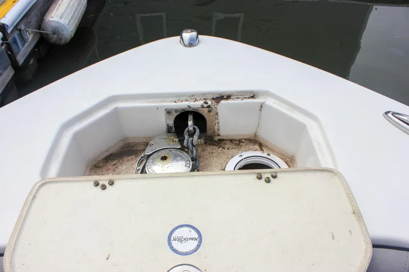 Slide: The Image of 2017 NauticStar 2602 Legacy boat interior with cushioned seating and speaker. - 24