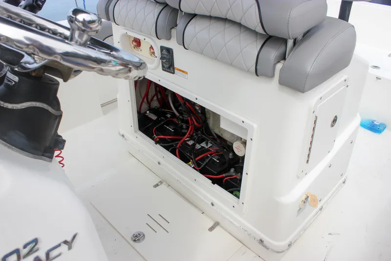 Slide: The Image of 2017 NauticStar 2602 Legacy boat seats at marina, featuring gray diamond-stitched upholstery. - 36