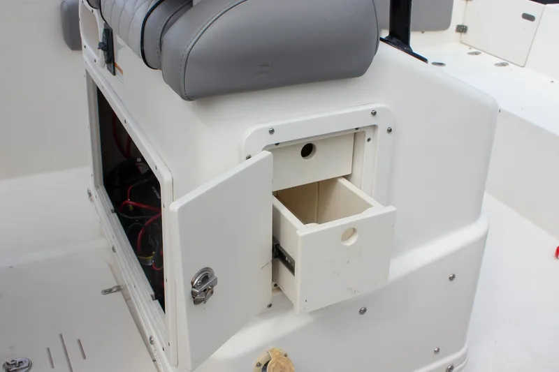 Slide: The Image of 2017 NauticStar 2602 Legacy boat interior showing battery compartment and seating. - 37