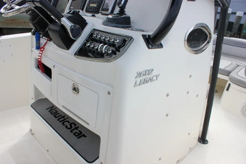 Slide: The Image of 2017 NauticStar 2602 Legacy boat interior with open storage compartments. - 38