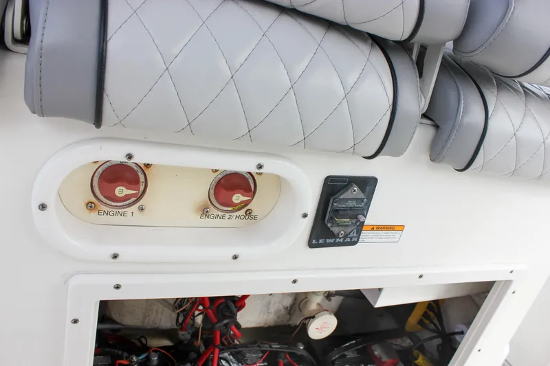 Slide: The Image of 2017 NauticStar 2602 Legacy boat console with controls and branding. - 39