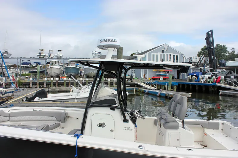Slide: The Image of 2017 NauticStar 2602 Legacy boat with dual Yamaha 150 engines at Harborside Marina. - 4