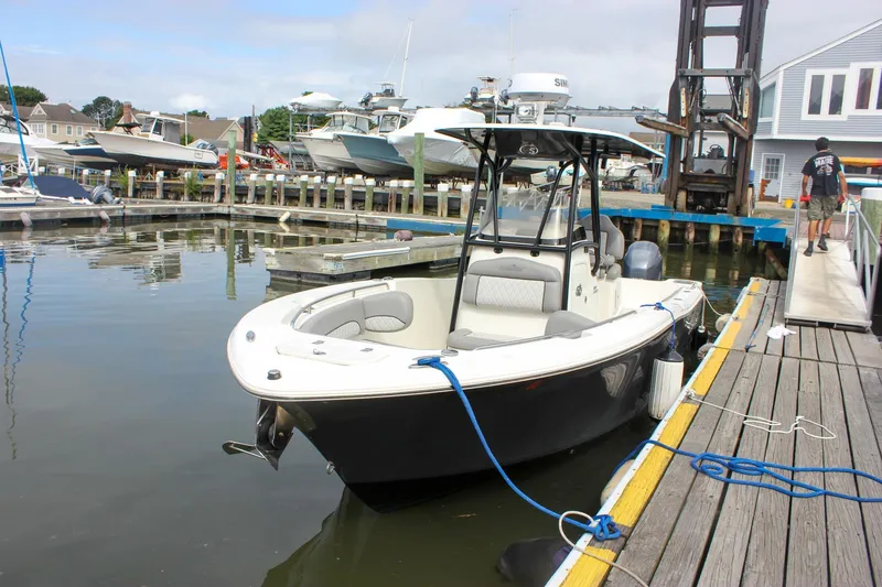 Slide: The Image of 2017 NauticStar 2602 Legacy boat interior with marine toilet and wiring. - 44