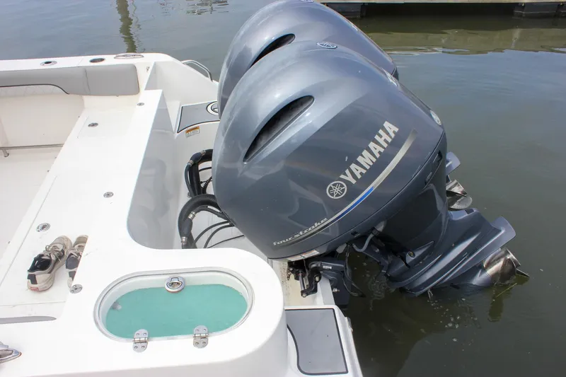 Slide: The Image of 2017 NauticStar 2602 Legacy boat interior with seating and console details. - 9