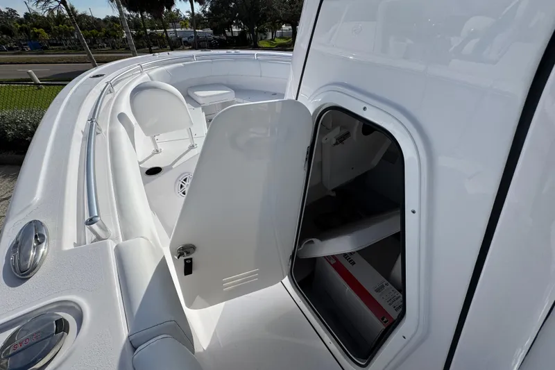 Slide: The Image of 2026 Sportsman Open 232 Center Console boat interior with open storage compartment. - 10