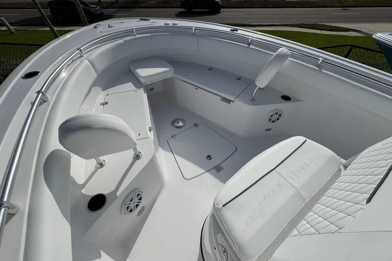 Slide: The Image of 2026 Sportsman Open 232 Center Console boat interior with seating and storage compartments. - 11