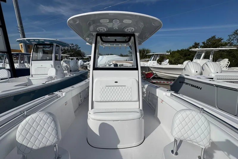 Slide: The Image of 2026 Sportsman Open 232 Center Console boat with sleek design and modern seating. - 12