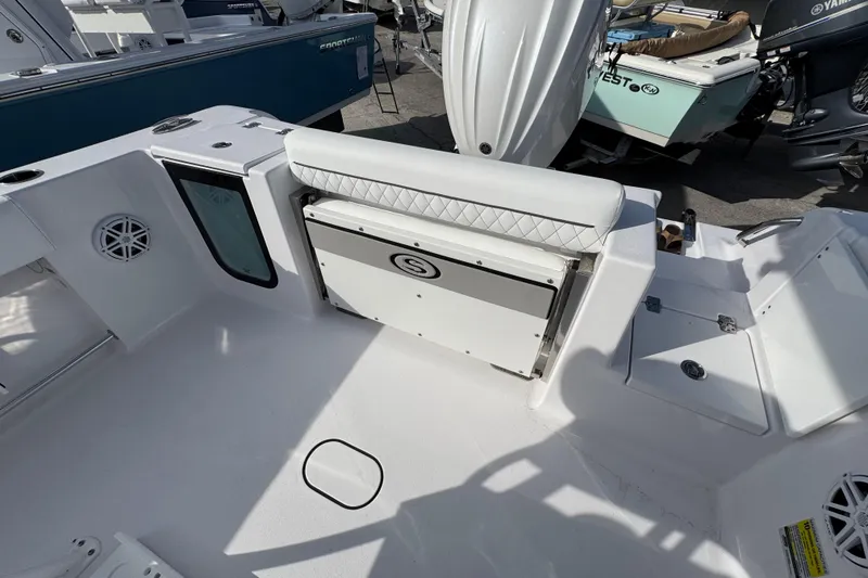 Slide: The Image of 2026 Sportsman Open 232 Center Console boat interior with seating and storage features. - 5