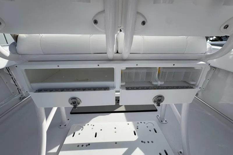 Slide: The Image of 2026 Sportsman Open 232 Center Console storage compartments and seating detail. - 7