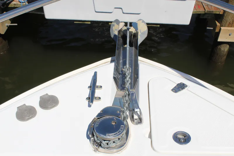 Slide: The Image of Bow of 2009 Boston Whaler 220 Outrage with anchor and chain mechanism. - 16
