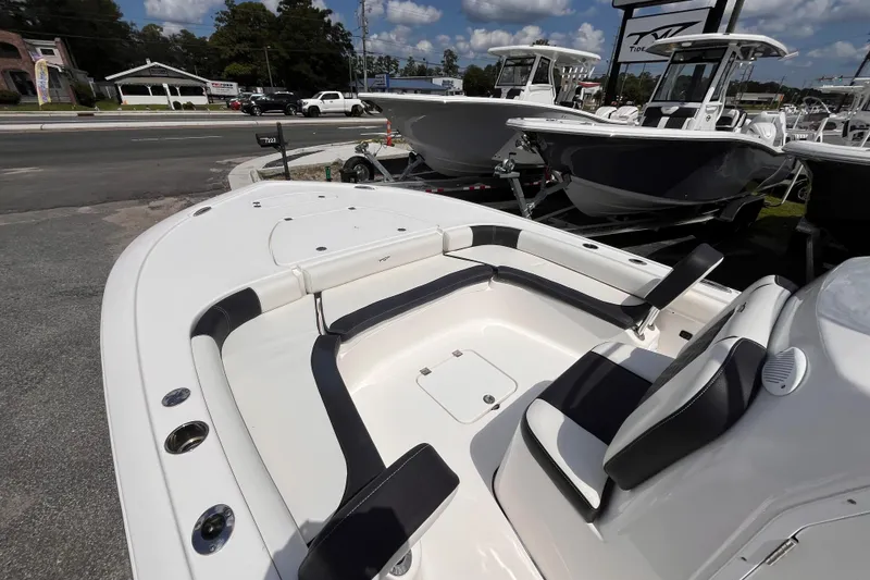 Slide: The Image of 2021 Tidewater 2500 Carolina Bay boat interior with seating, displayed outdoors. - 12