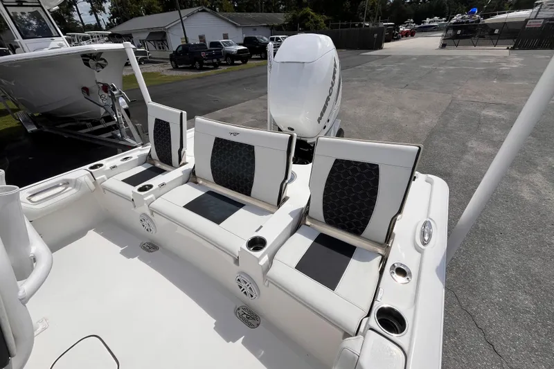 Slide: The Image of 2021 Tidewater 2500 Carolina Bay boat with stylish seating and powerful outboard motor. - 14