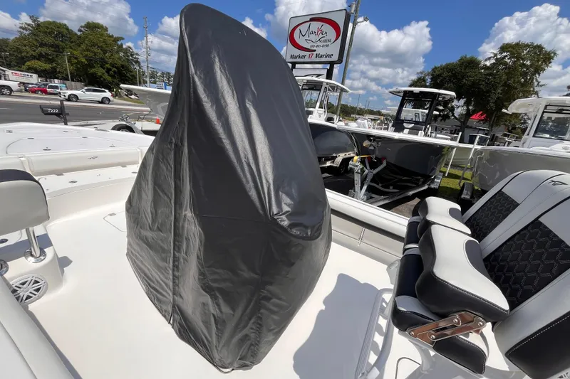 Slide: The Image of 2021 Tidewater 2500 Carolina Bay boat interior with covered console and seating. - 16